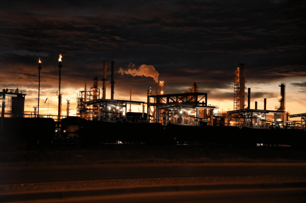 the sunset horizon view of industrial buildings and smokestacks