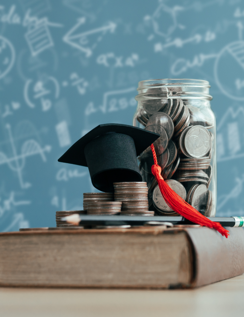 photo of change in jar with graduation cap and textbook