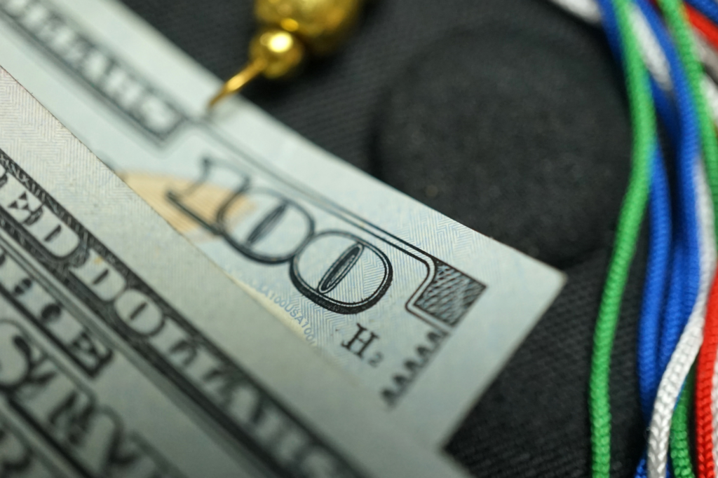 Photo of money with graduation cap and tassle