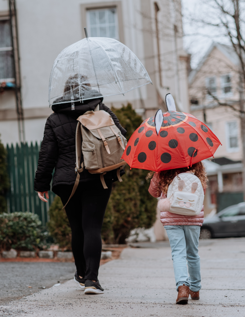 Parenting student mother walking with child