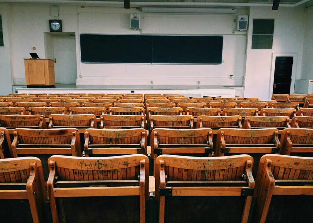 empty classroom facing chalkboard