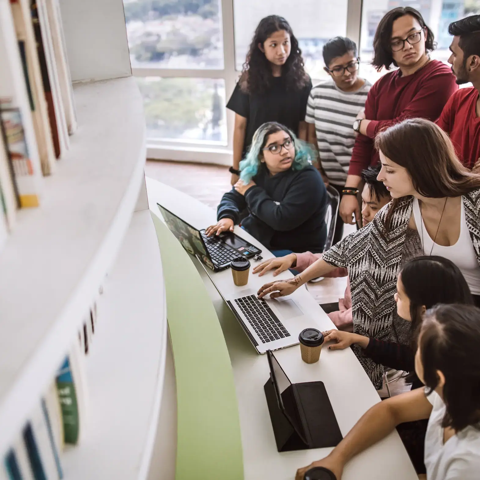 Students surrounding computers