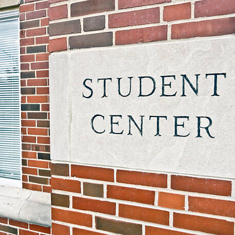 Student center sign on a brick building