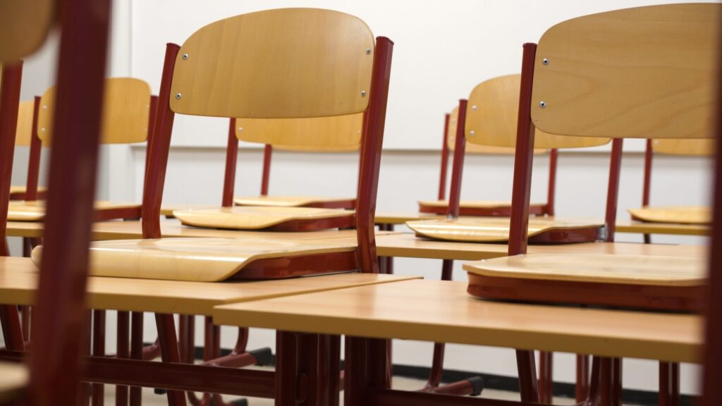 chairs on desks in classroom