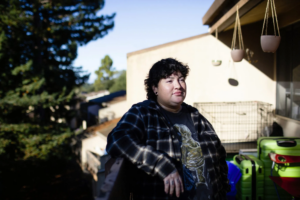 Photo of Elizabeth Clews on the deck outside her home