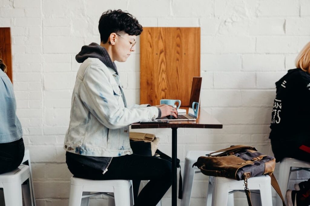 student working on a laptop in cafe