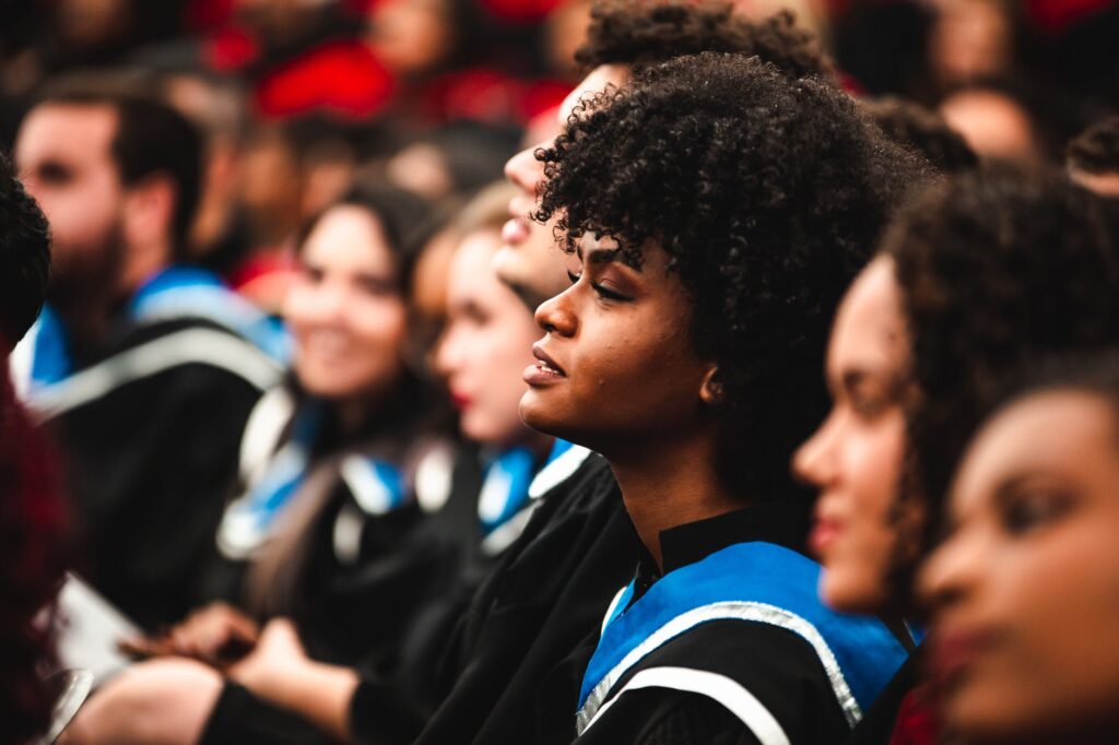 students listening to a speaker at graduation ceremony