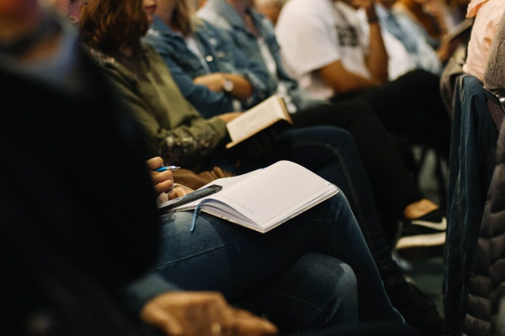 students sitting in lecture taking notes