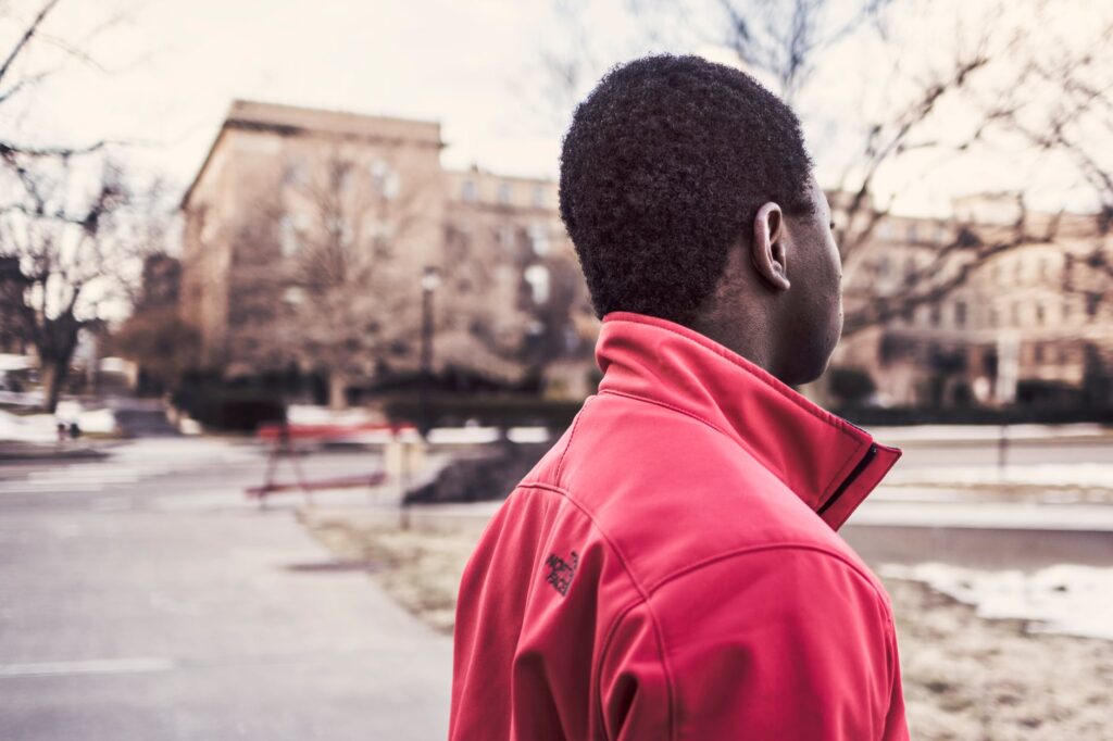 side view of a man in front of school