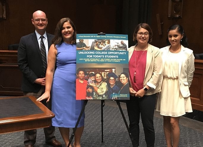 State Leaders Press for Student-Centered Higher Learning Education Policies Four Adults around poster for Unlocking College Students Opportunities For Today's Students